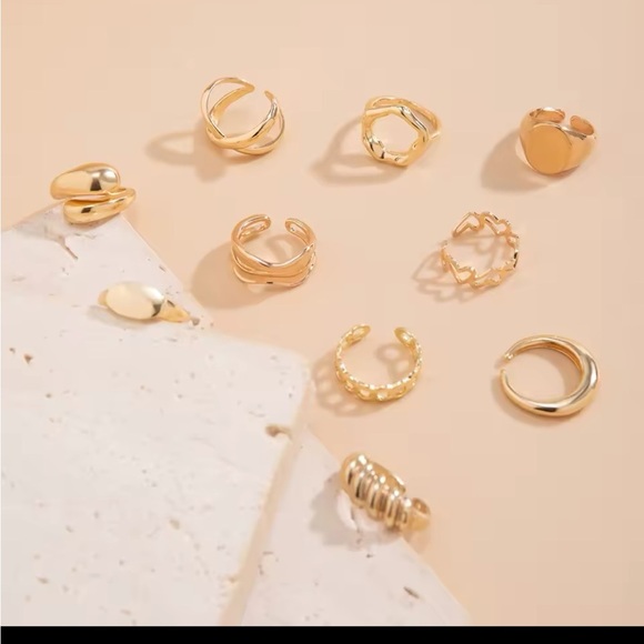 Radiant Gold Ring with Intricate Detailing and Sparkling Gemstones
10 piece set - Picture 2 of 4